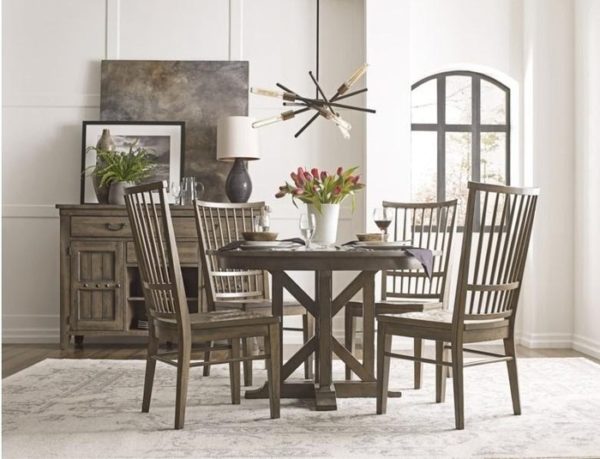 This wood style round dining table by Kincaid is a great place to add accent home decor.