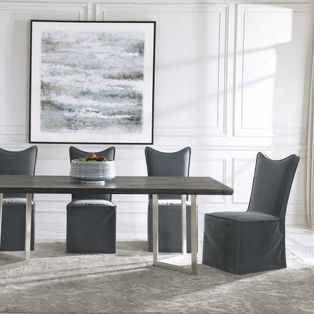 Armless dining chars by Uttermost displayed in a beautiful dining room