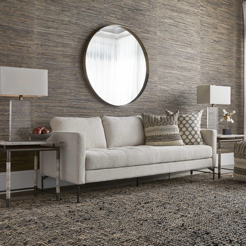 Cream colored sofa by Uttermost used for home decorating