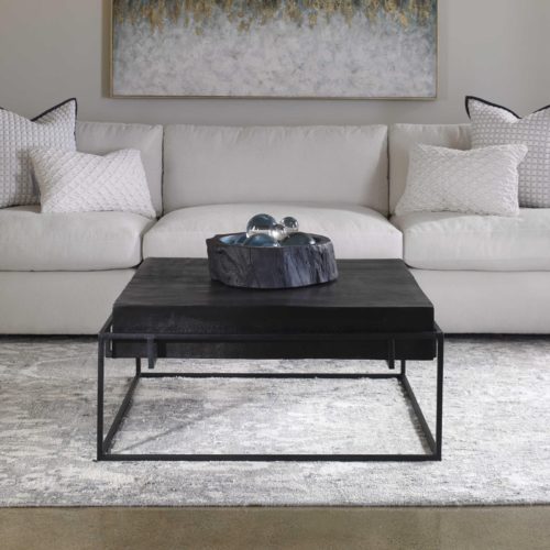 Dark colored decorative coffee tables by Uttermost. 