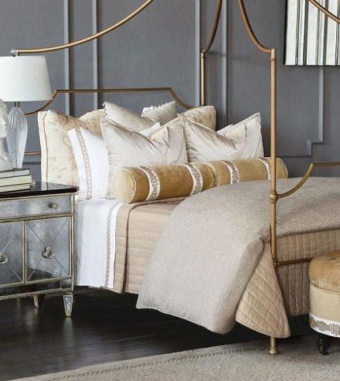 bedroom decor featuring a gold toned bed spread