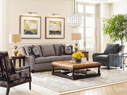 Charcoal grey living room set with a couch, and 2 accent chairs.
