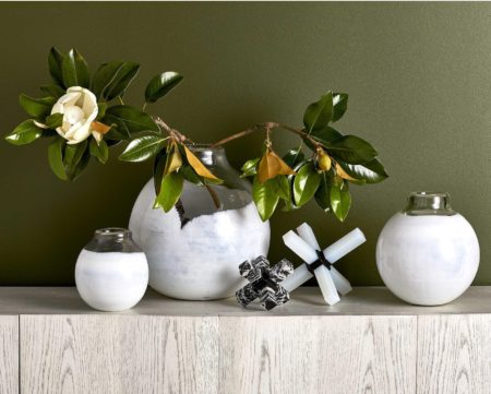 fake plant and flower pots on a shelf as kitchen decor