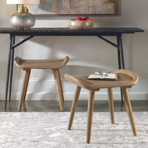 a black bench with brown stools